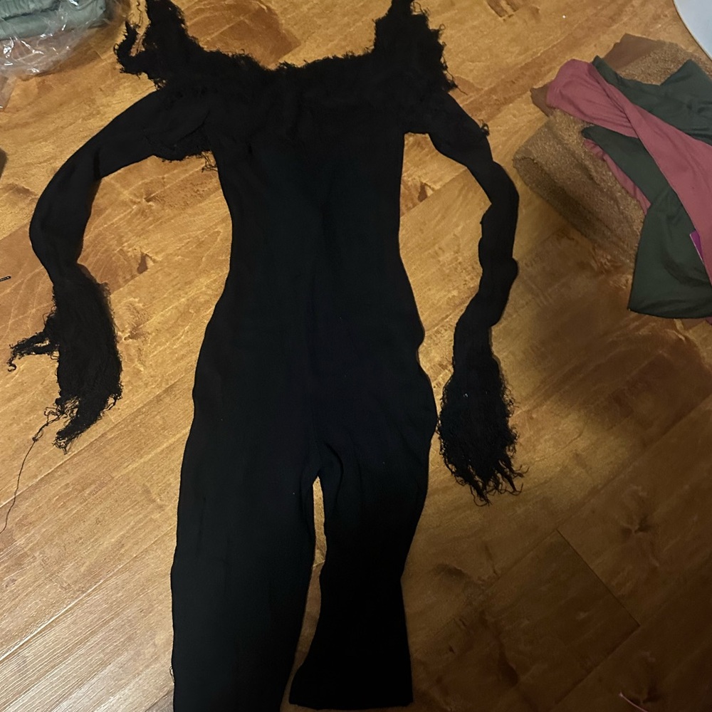 Black Off-Shoulder Jumpsuit with Fringed Sleeves